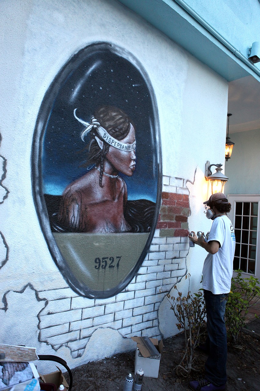 Erin Johnson works on a vertical piece Sunday, Nov. 4, during the Sarasota Chalk Festival.