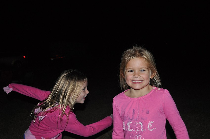 Sienna Munns and Ava Munns chased each other.