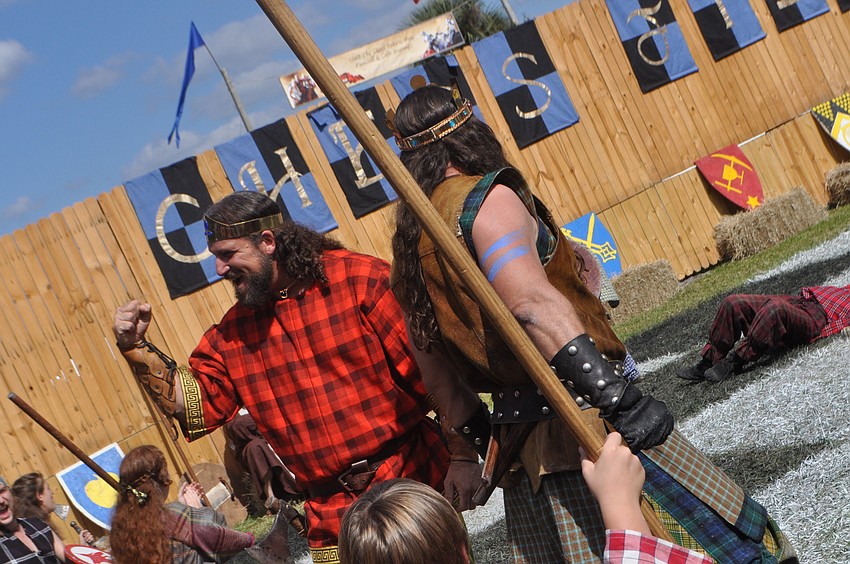 Artistic Director Dean Bowers plays one of the high kings and cheers with the crowd.