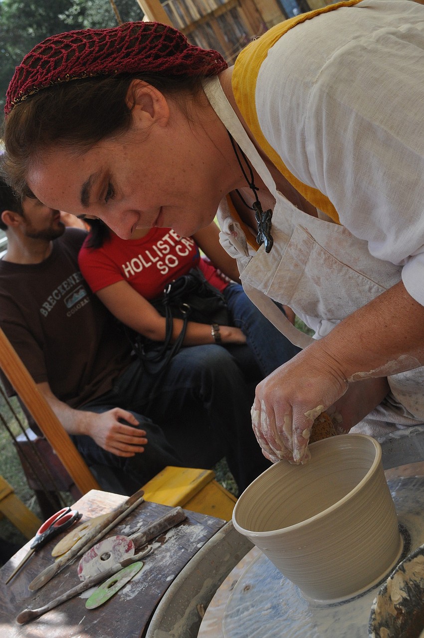 Susan Kennedy demonstrates how to make pottery.