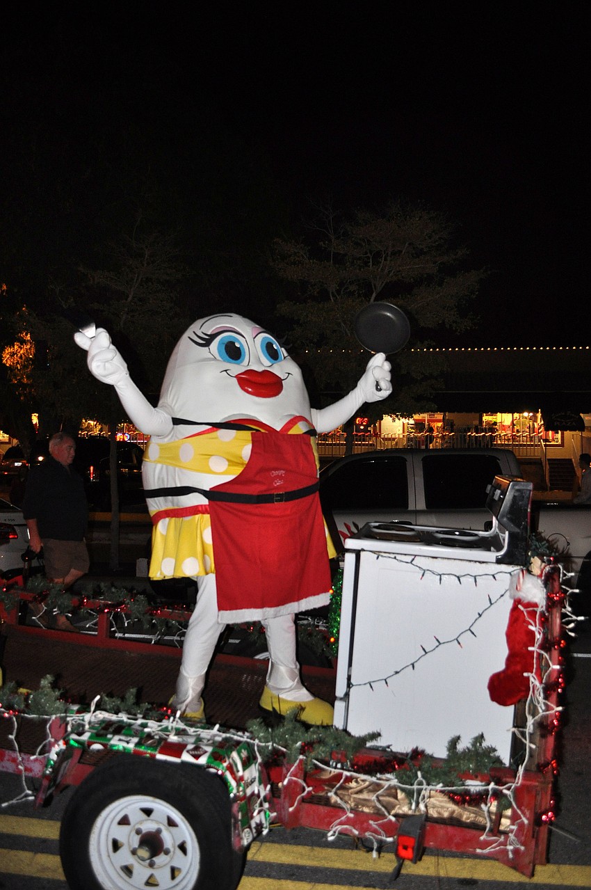 Eggwina pretended to cook on the back of the Broken Eggâ€™s float.