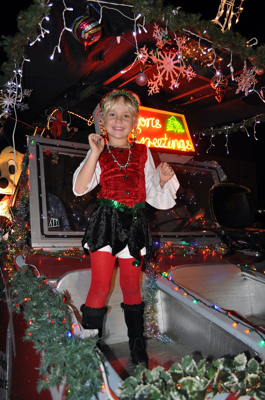 Hailee Canfield, 6, rode on the SCTI/McIntosh Middle School/Future Farmers of America float Saturday, Dec. 1, during the Downtown Sarasota Holiday Parade.