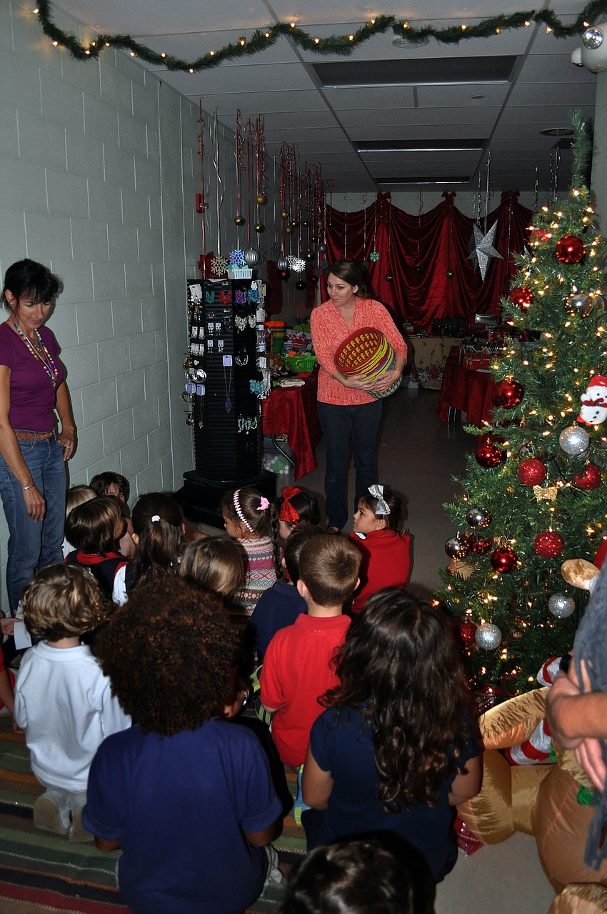Students at Southside Elementary find out about how the Holiday House works before being allowed to shop Tuesday, Dec. 4.