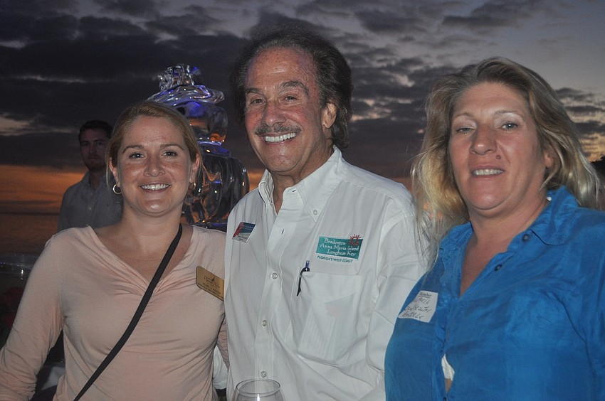 Tammy Angel (left) and Teresa Alexander of Dieterâ€™s Sod Service, with Richard Perlman of Michael Saunders