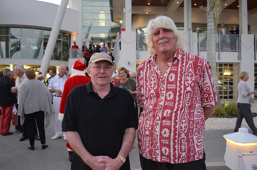 Tom Casasent and John Hammes. Hammes decorated his 1958 sail boat with festive lights.