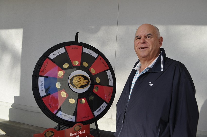 Bob Finger won a keychain after spinning the prize wheel on opening day.