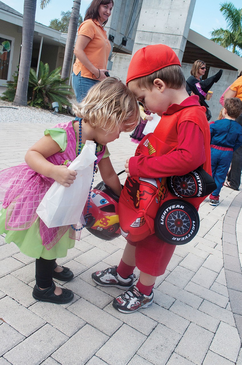 Henry Gilbertson shares his candy with Victoria Maypole at St. Boniface Preschoolâ€™s Halloween Parade, Oct. 31.