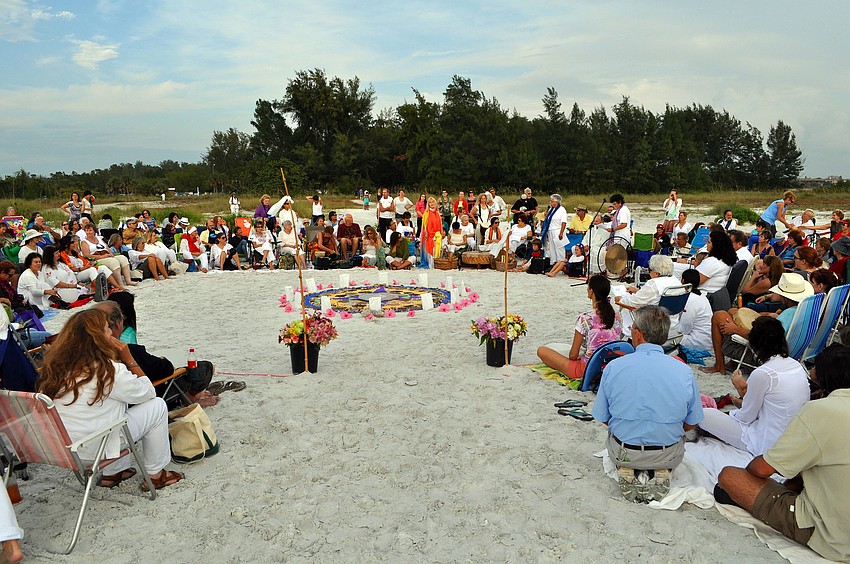 Hundreds of people gathered Wednesday, Dec. 12, on South Lido beach for the 12.12.12 Sands of the World Mandala ceremony.