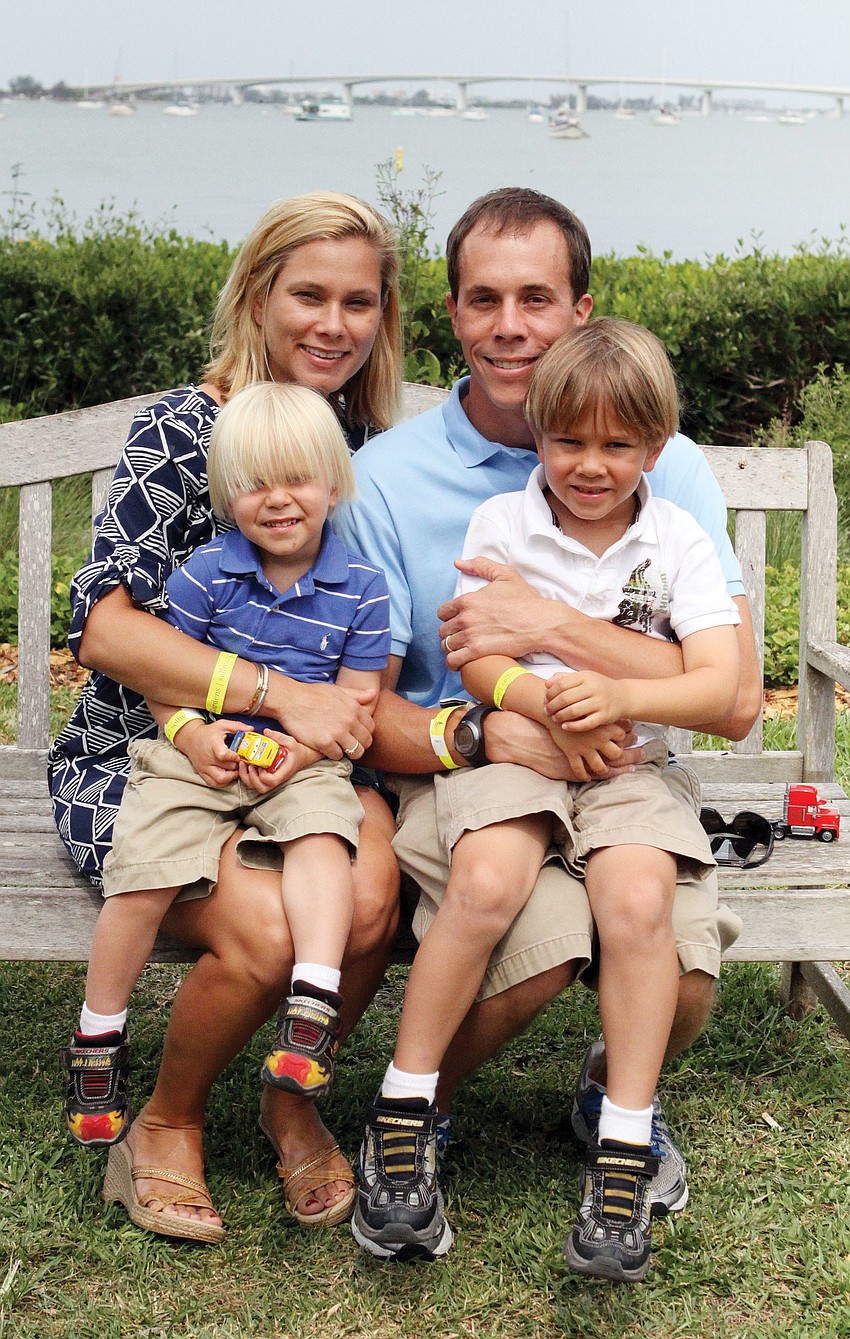 Erika and Sam Quartermaine pose with their sons, Cameron, 3, and Ethan, 6, at the Motherâ€™s Day Brunch at Marie Selby Botanical Gardens.