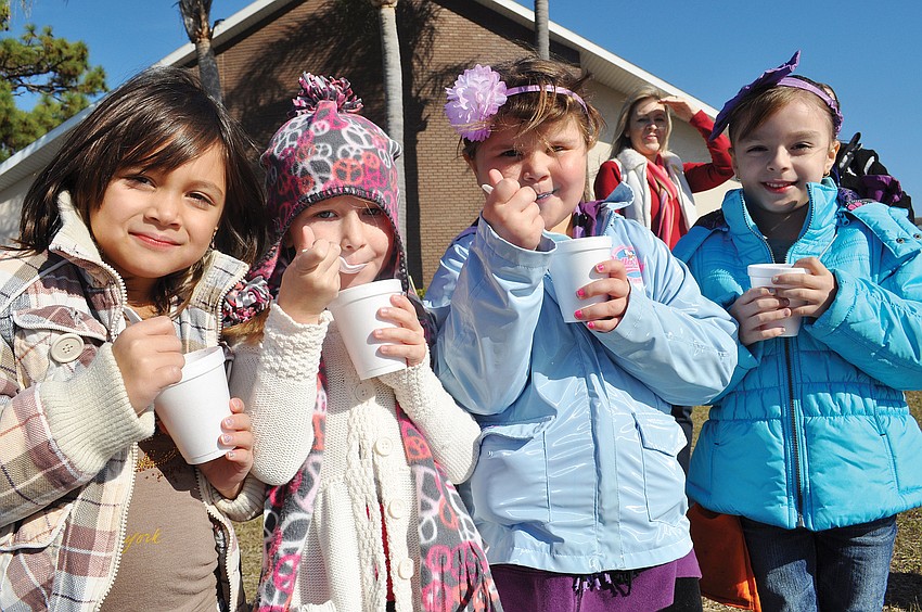 Students Alana Kutt, Kylee Pavkovich, Abby Mosher and Mariela Cheno enjoyed snow cones as they watched their friends sled at the Tabernacle Christian School's Winter Wonderland celebration Jan. 30. Published Feb. 2, 2012.