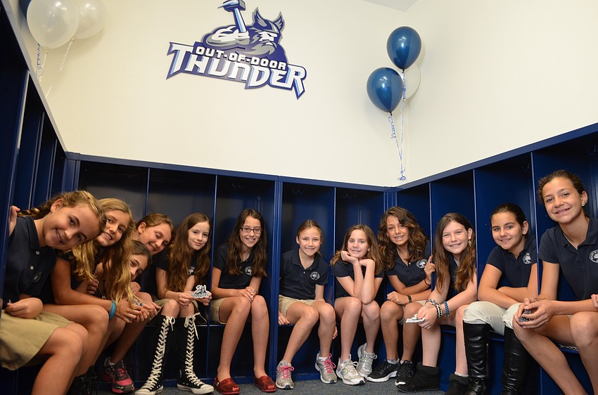 Fifth grade girls check out their new changing station.