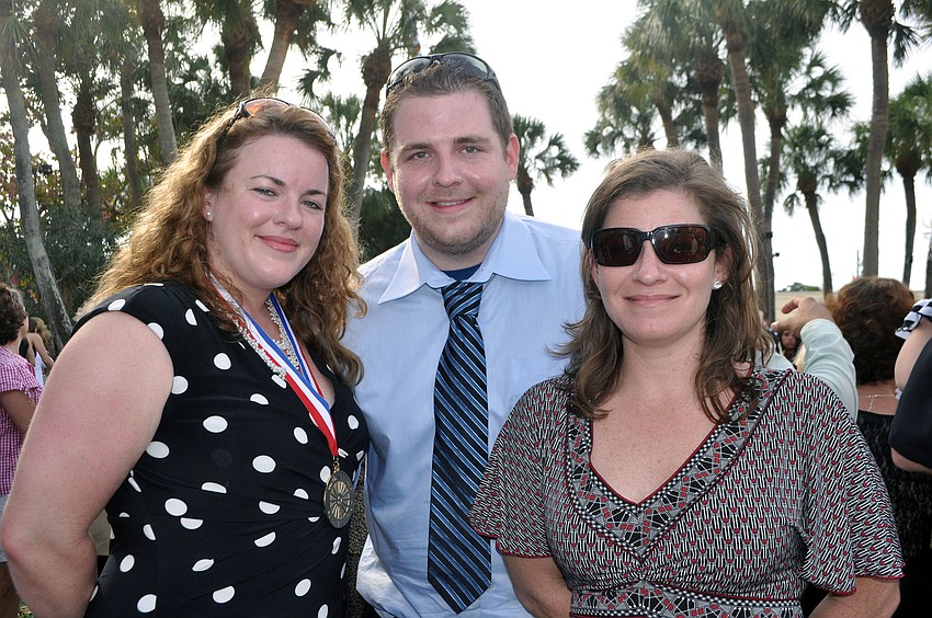 Adrienne, Matthew and Megan Holst accepted the Ring of Fame award on behalf of their late father, Tim Holst.