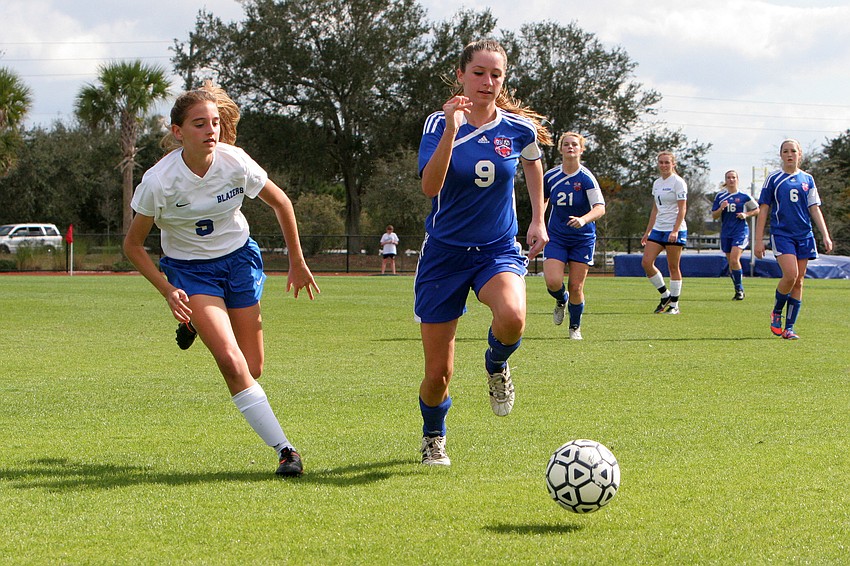 Sarasota Christianâ€™s Taylor Smith, No. 9, and Northside Christianâ€™s Briana Meehan, No. 9, run after the ball.