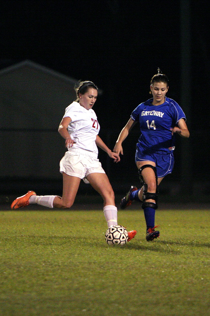 Cardinal Mooneyâ€™s Sarah Quick, No. 27, prepares to kick the ball up the field as Gatewayâ€™s Kelsey Anders, No. 14, tries to stop Quick.