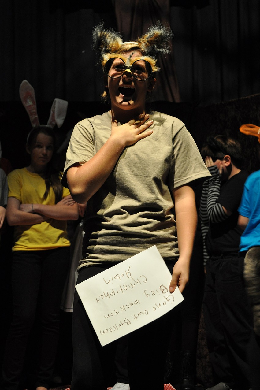 Gwyn Morse, as Owl, shares her thoughts on a note left by Christopher Robin.