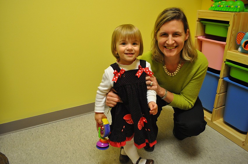 Dr. Jennifer Swanson and Sophia Freeman in Paytonâ€™s Playroom. The Payton Wright Foundation donated $2,000 worth of toys to the room.