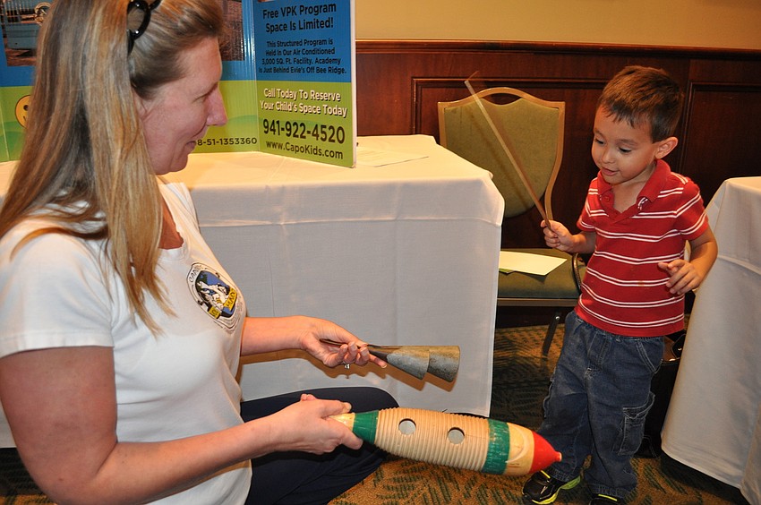 Alex Johnson made music with Jeanne Thompson at the CapoKids Preschool station.