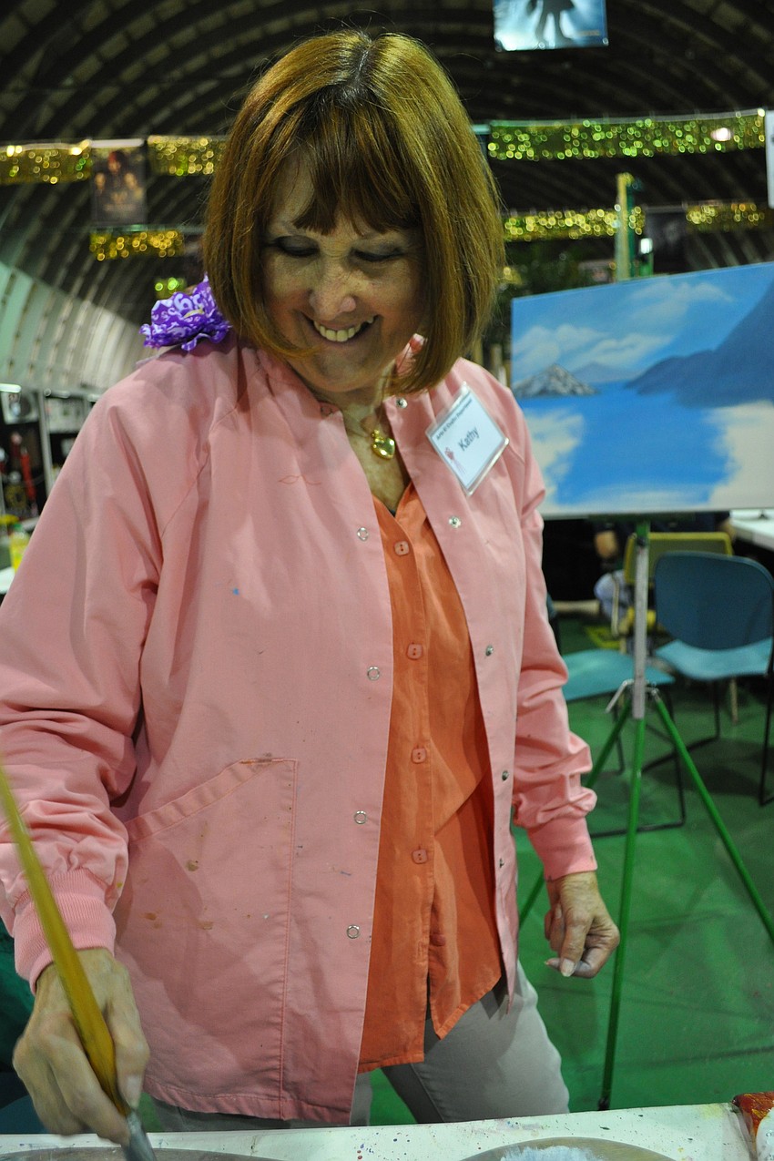 Kathy Rodd demonstrated how to paint a landscape. She was stationed in the craft section of the fair.