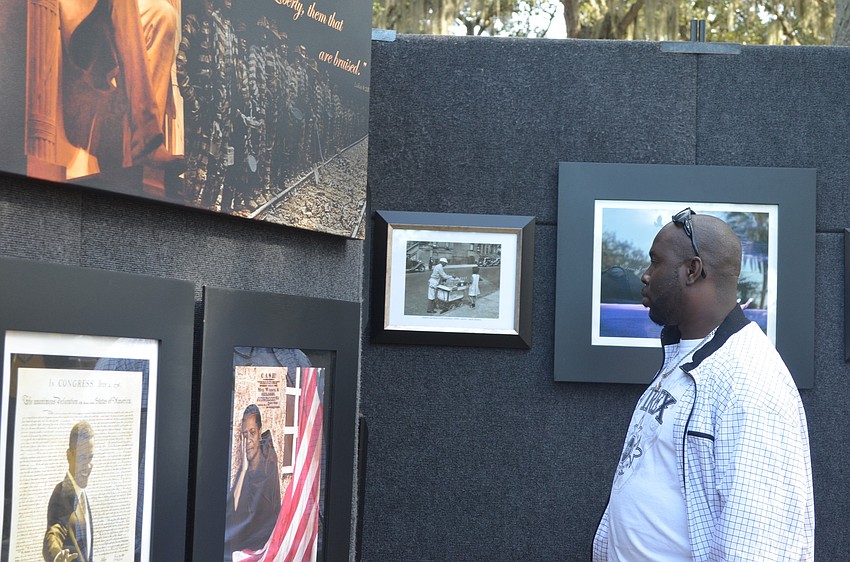 Alford Sanders looks over The Long Road, an exhibit by The Human Spirit Foundation.