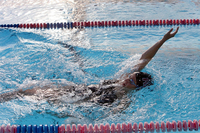 Taylor Katz, 12th grade at Riverview High School, does the backstroke during a swim meet Wednesday, Sept. 12 during a swim meet at the Sarasota YMCA at Potter Park.