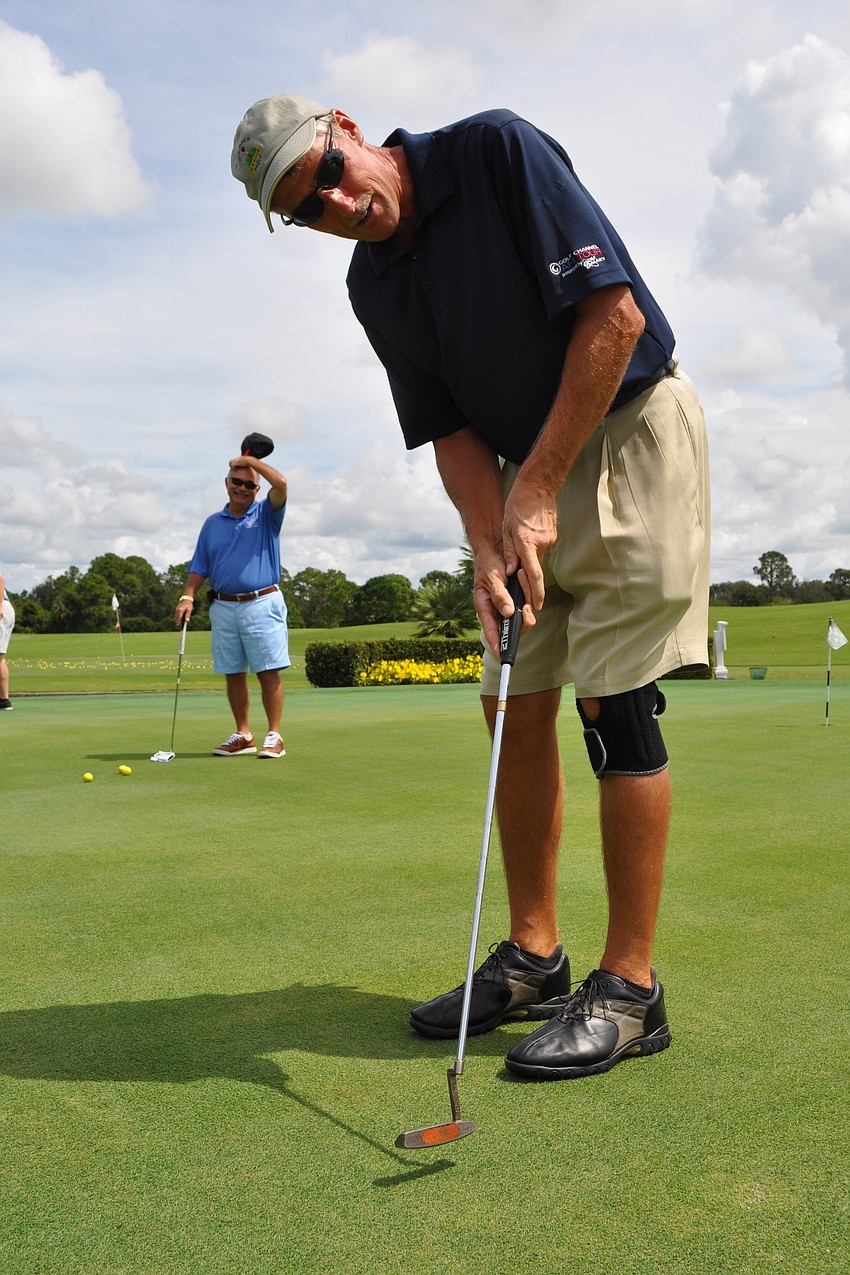 Craig DelFabro got in some putting practice before the tournament started.