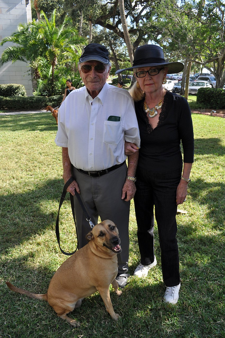Jack and Sally Jaret stand with their dog, Maggie.