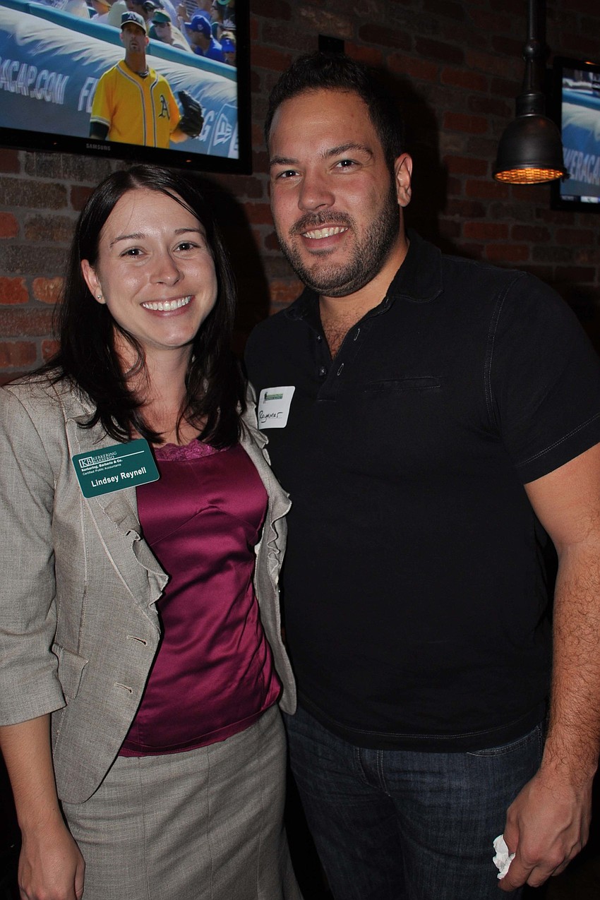 Lindsey Reynell, of Kerkering Barberio, with Raymmar Tirado, of CR8 Inc.