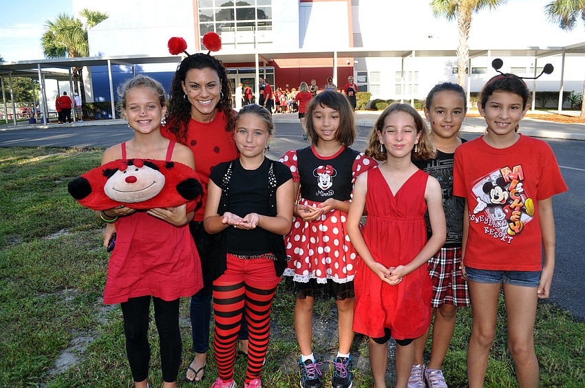 Savannah Crittenden, 10, Maria Dent, 4th grade teacher, Ireland Waelti, 9, Aurora Mendoza, 9, Maggie Mazzella, 9, Vlada Biletska, 9, and Aimee Herrera, 10