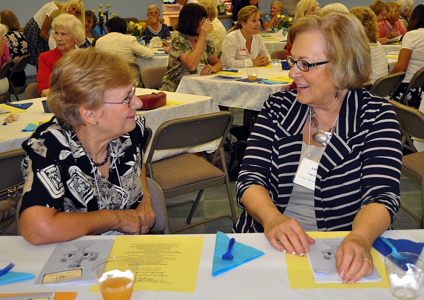 Donna Jean Leuchter and Arline Napiecek chit-chat Tuesday, Oct. 16, at the welcome back luncheon for the womenâ€™s guild of St. Mary Star of the Sea.