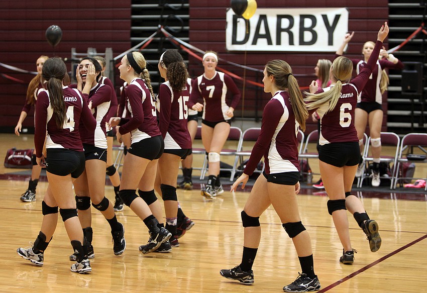 The Lady Rams celebrate as they prepare to go for their final point against the Lady Tornadoes Tuesday, Oct. 16, at Riverview High School.