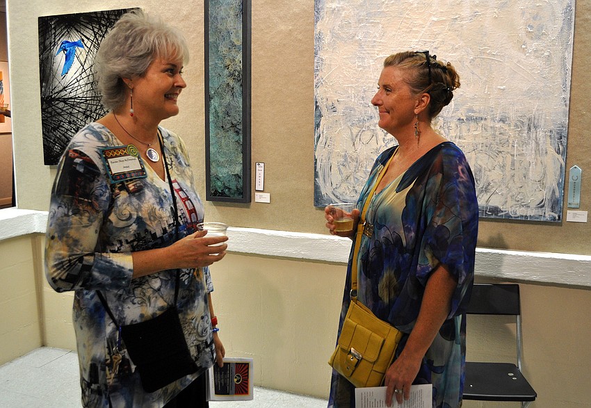Raven Skye McDonough and Nicki LeMarbre chat with one another Thursday, Oct. 18, during the opening of four different shows at Art Center Sarasota.