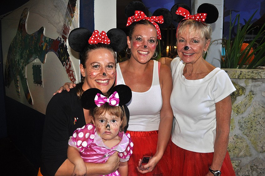 Finnley Jones, 2 Â½, Mackenzie Jones, Kerbe Jones and Pat Jones all dressed up as Minnie Mouse Friday, Oct. 19, during MOTEâ€™s Night of Fish, Fun and Fright.