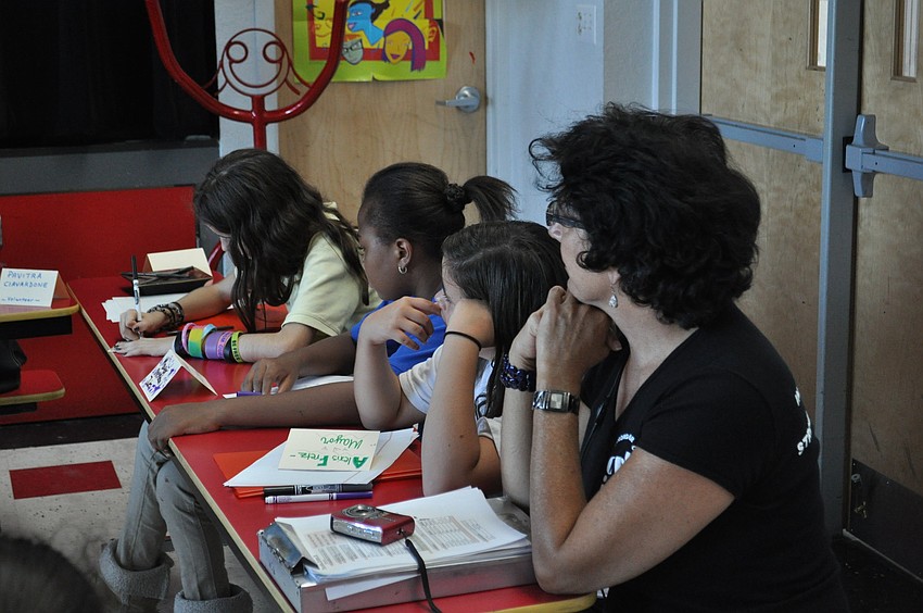 Students take notes as Mayor Suzanne Atwell speaks.