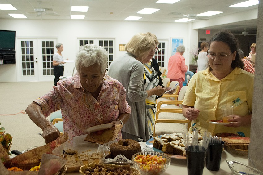 Garden Club members help themselves to refreshments.