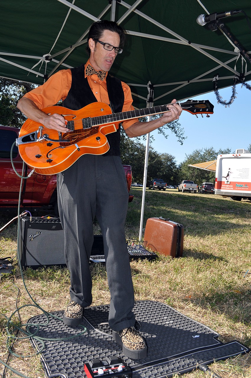 Ted Stevens rocks out in his leopard print bowtie and platform shoes Wednesday, Oct. 31, at the Phillippi Farmhouse Market.