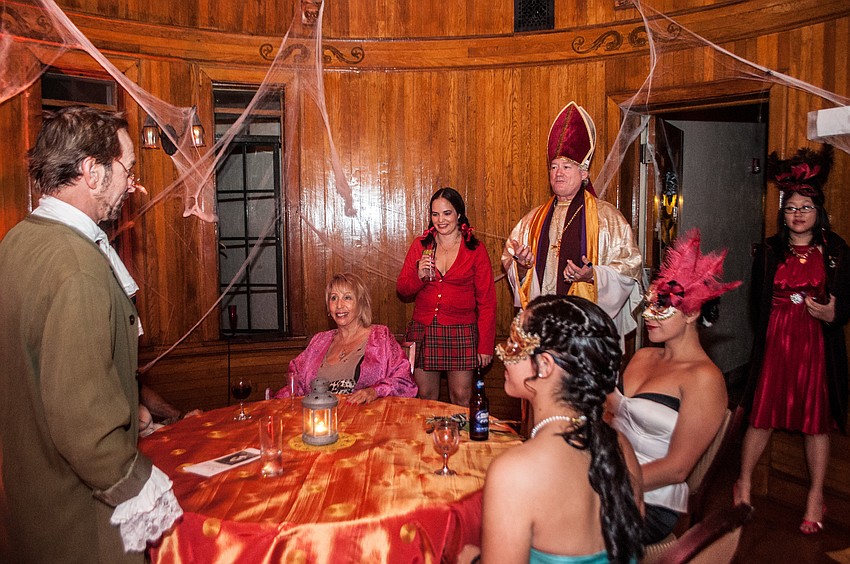 Actor Peter Swarenz entertains guests in the astrology room.