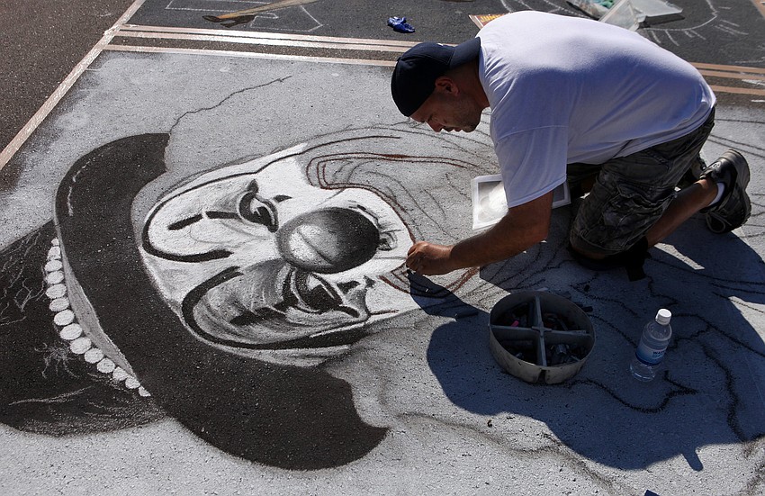 David Lepore works on his black and white clown.