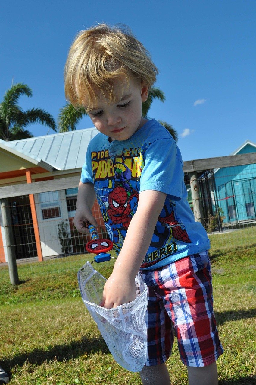 Jackson Chapman, 3, tried out several of the games.