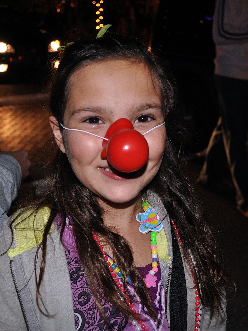 Samantha Gentile, 10, wore a big red nose Saturday, Nov. 24, during Siesta Keyâ€™s Light Up the Village parade.