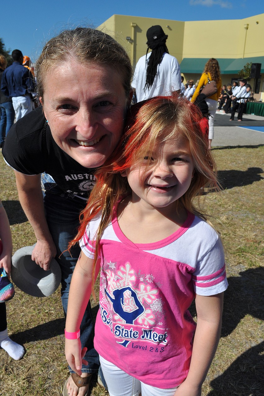 Emilie Mckenna, pictured with her mom, Niki, liked playing on the bounce house.