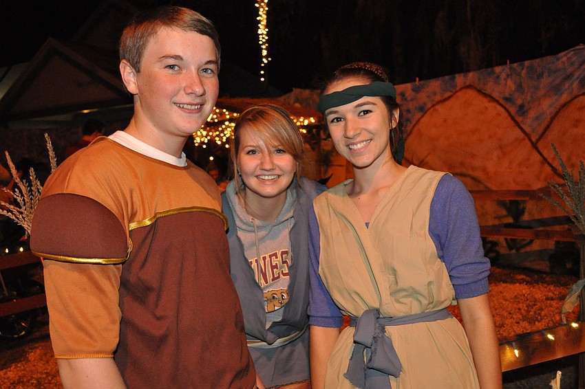 Quentin Murphy, Caitlin Hermanson and Shannon Furey dressed as townspeople.