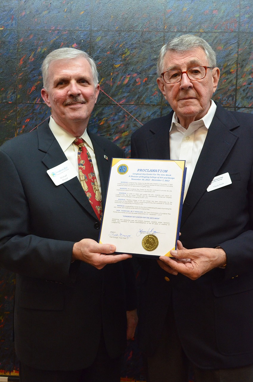 Vice President for Advancement Michael Moore and Chairman of the Board of Trustees Chuck Smith