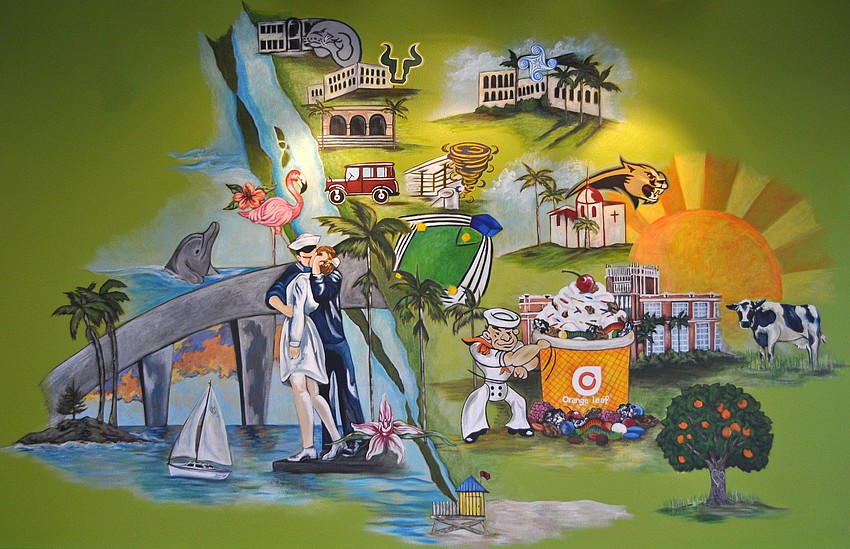 A mural created by Christina Tomae highlights different aspects of Sarasota inside Orange Leaf Yogurt.