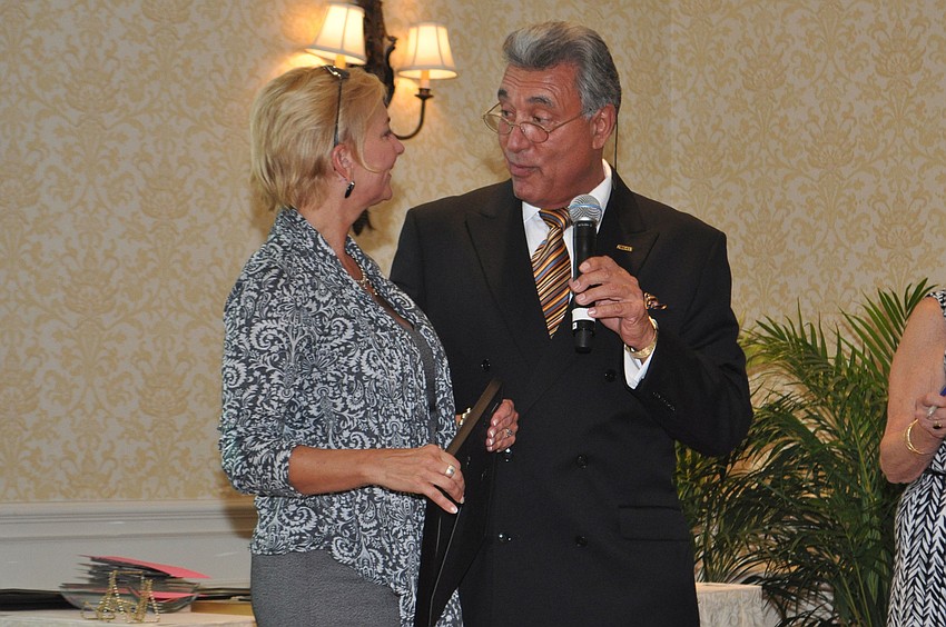 Sandra Rios accepted a certificate on behalf of Longboat Key Club and Resort from outgoing St. Armand's Circle Association president Andrew Vac May 15 at the Ritz-Carlton Sarasota.