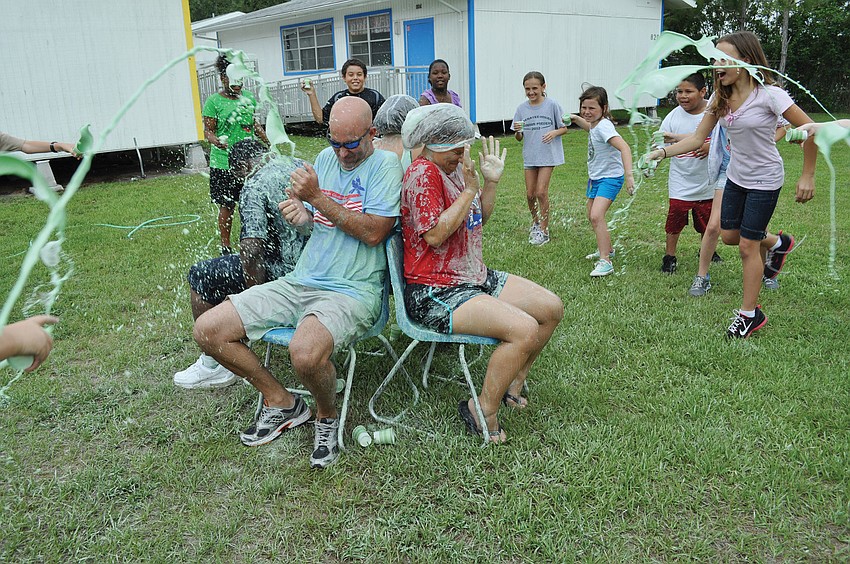 Freedom Elementary Principal Jim Mennes and fourth-grade teacher Amanda Hirst got drenched with slime May 30. Published June 7, 2012.