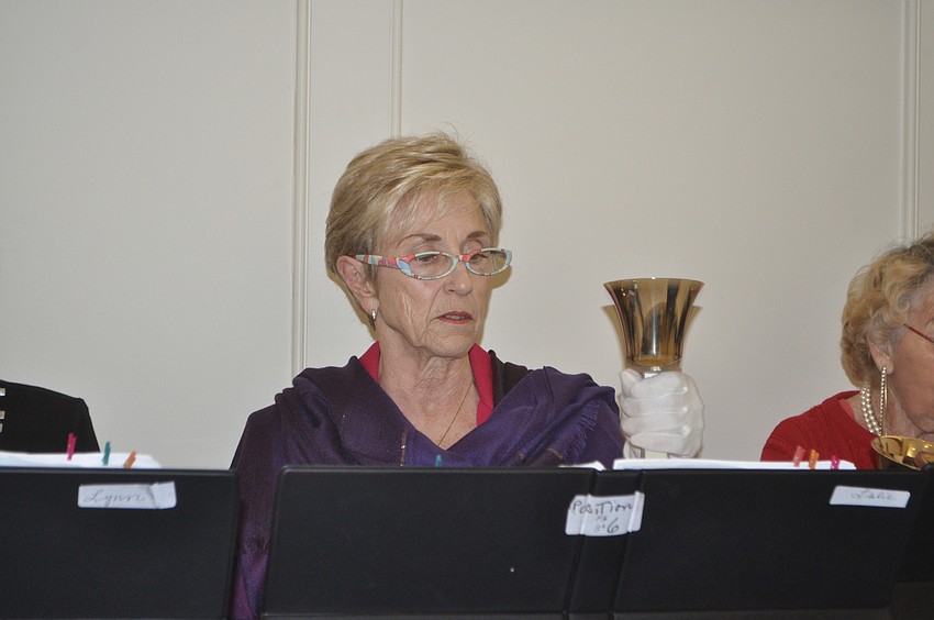 Leslie Farrington rings a bell in the carol, 