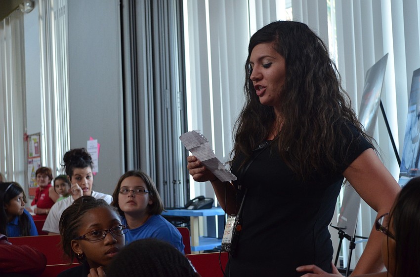 Lindsay Hopkins reads out loud why she voted Zandy Sanders to be Girl of the Year.