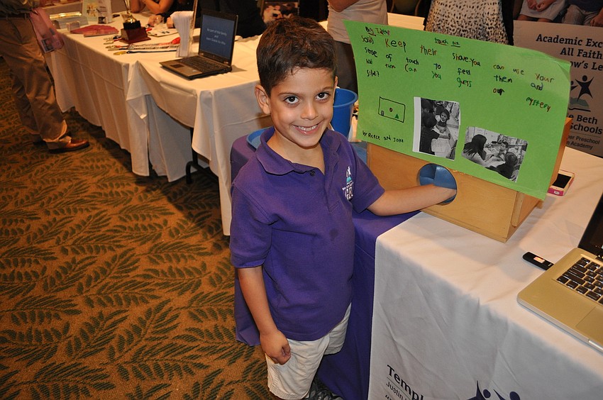 Tyler Ruben learned how solids keep their shape at the Temple Beth Sholom table.