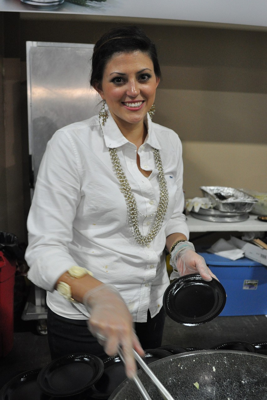 Eleni Sokos serves Greek salad from Demetrio's Pizza House.