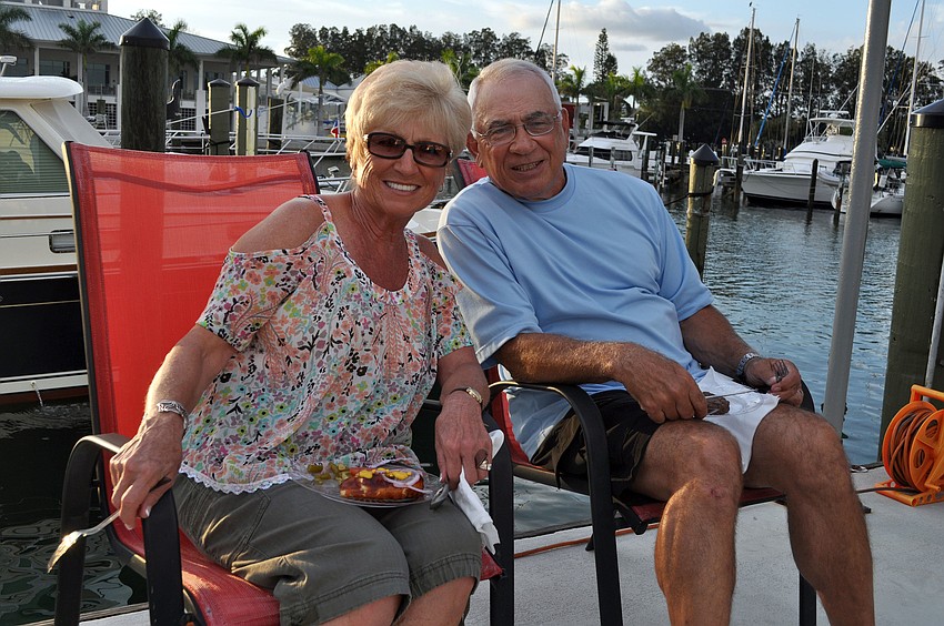 Margit and Dick Gravino get ready to each some food at the dock party Saturday, Sept. 22 at Sarasota Yacht Club.
